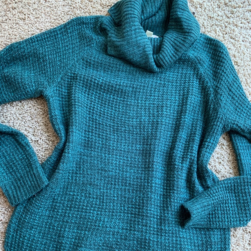 Two women’s sweaters